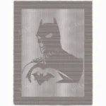 Stylized Batman silhouette on knitted blanket