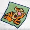 Tigger C2C blanket crochet pattern featuring the playful tiger from Disney Winnie the Pooh stories in a lively, relaxed pose.