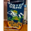 Finger knit blanket pattern featuring Notre Dame Fighting Irish Leprechaun design in blue, green, and gold colors, bold sports-inspired chunky knit blanket chart