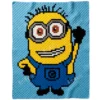 Minion Phil C2C crochet blanket on light blue background, full-body character with one arm raised, yellow body, silver goggles, blue overalls, pixel-style handmade blanket