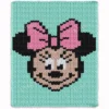 Minnie Mouse face knitting chart blanket in mint green background with pink bow, chunky yarn, pixel-style design, cozy handmade baby blanket