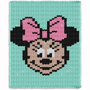 Minnie Mouse face knitting chart blanket in mint green background with pink bow, chunky yarn, pixel-style design, cozy handmade baby blanket