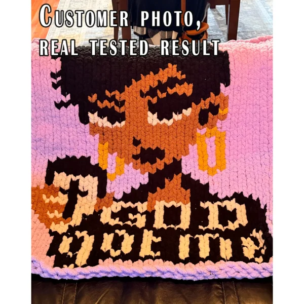 God Got Me chunky knit blanket pattern featuring a portrait of a Black woman with a short haircut holding a coffee cup, set against a pink background with the text God Got Me in black and white lettering, knitted in jumbo yarn using finger knitting colorwork technique.