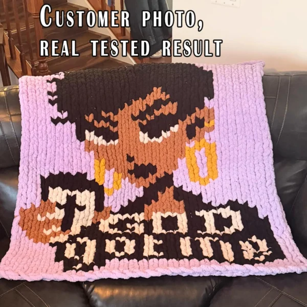 God Got Me chunky knit blanket pattern featuring a portrait of a Black woman with a short haircut holding a coffee cup, set against a pink background with the text God Got Me in black and white lettering, knitted in jumbo yarn using finger knitting colorwork technique.