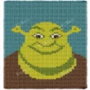 Shrek portrait finger knitting blanket made with chunky chenille yarn, featuring a large green ogre face with signature ears on a sea blue and brown background, cozy handmade graphghan throw pattern for jumbo plush yarn.