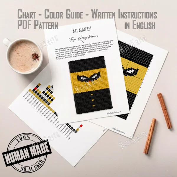 Chunky knit blanket pattern featuring a pixel-style superhero design with a black mask, white eyes, yellow suit, black cape, and button details on a bold black and yellow background.