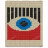 Bauhaus-inspired chunky knit blanket featuring a bold geometric eye design in blue, black, red, and ivory colors, made with plush jumbo chenille yarn in a modern abstract finger knitting style.