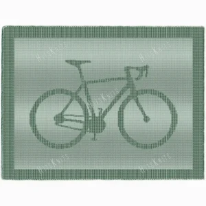 Knitted blanket featuring a bicycle motif in the center, worked in garter stitch against a stockinette background. The blanket has a textured border framing the bike design. The bicycle is shown in a side profile with detailed wheels, frame, handlebars, and pedals, suitable for cyclists, bike lovers, teens, and adults.