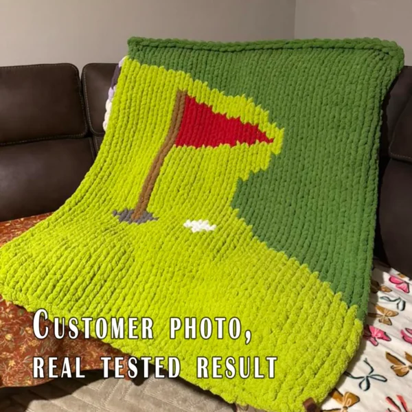 Golf-themed chunky knit blanket pattern featuring a green putting course with a red golf flag, golf hole, and white golf ball. The design is worked in chunky chenille-style stitches with bold shades of green, creating a soft and cozy sporty blanket perfect for golf lovers, boys’ rooms, game rooms, man caves, and handmade gifts.