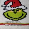 Grinch Face Finger Blanket knitting pattern by HitsKnits - holiday graphghan in ivory, green, red and black jumbo yarn