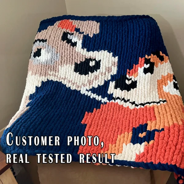 Chunky knitted blanket featuring Lady and the Tramp in a close-up face-to-face pose on a navy blue background. The design shows the two classic cartoon dogs with expressive eyes, floppy ears, soft beige and brown fur, and playful smiles in colorful pixel-style stitches. Cozy romantic graphghan blanket
