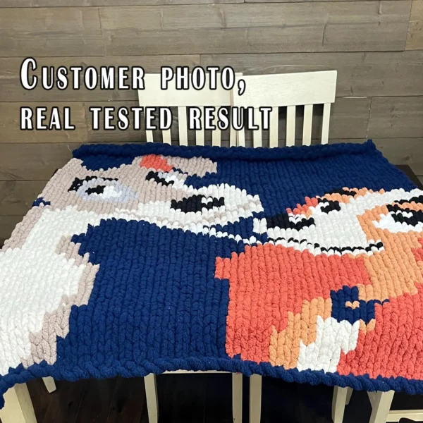 Chunky knitted blanket featuring Lady and the Tramp in a close-up face-to-face pose on a navy blue background. The design shows the two classic cartoon dogs with expressive eyes, floppy ears, soft beige and brown fur, and playful smiles in colorful pixel-style stitches. Cozy romantic graphghan blanket