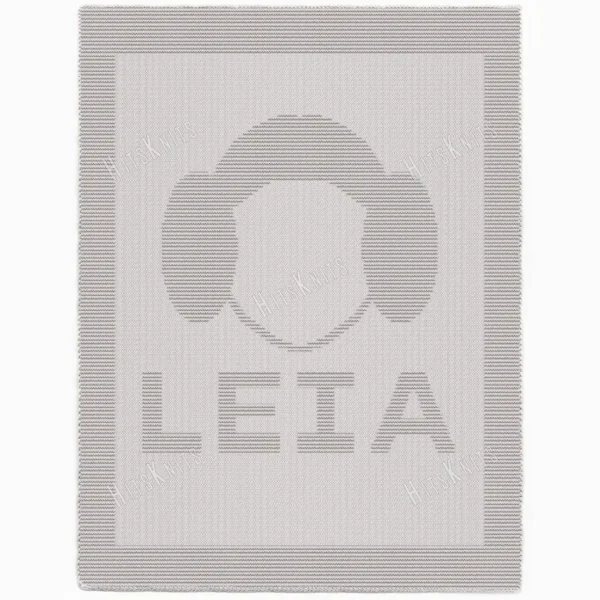 Minimalist knitted blanket featuring a stylized Princess Leia face silhouette with her iconic side buns and the word “LEIA” below. The design is worked in textured garter stitch against a smooth stockinette background, all in a soft neutral color palette with a wide garter stitch border. A modern and cozy blanket design inspired by classic sci-fi themes, perfect for kids’ rooms, reading nooks, movie nights, and Star Wars fans of all ages.