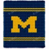 Michigan varsity style chunky knit blanket featuring a bold yellow letter M on a deep blue background with sporty stripe accents, handmade with plush jumbo chenille yarn in a cozy finger knitting graphghan design.
