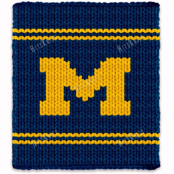 Michigan varsity style chunky knit blanket featuring a bold yellow letter M on a deep blue background with sporty stripe accents, handmade with plush jumbo chenille yarn in a cozy finger knitting graphghan design.