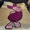 Piglet C2C crochet blanket pattern featuring Winnie the Pooh Piglet character on a pastel yellow background, handmade graphghan blanket design in pixel crochet style.