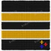 Chunky knit striped blanket inspired by Pittsburgh Steelers football colors, featuring bold black and gold horizontal stripes with white accent lines on a soft plush textured background. The lower corner includes the classic three-diamond symbol in yellow, red, and blue.