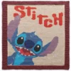Hand-knitted Stitch character square panel with a mauve garter stitch border on a cream background. The design features Stitch from Disney’s Lilo & Stitch with sparkling black eyes, an open smiling mouth, denim and sky blue fur, lilac ears, and bold coral “STITCH” lettering above. Colorwork knitting design created with white, mauve, black, navy, lilac, coral, denim, sky, cream, and red shades.