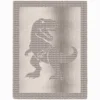 Knitted blanket featuring a textured Tyrannosaurus rex silhouette in the center, worked in garter stitch against a stockinette background. The blanket has a wide textured border framing the dinosaur design. The T-Rex is shown in a standing pose with detailed claws, tail, and open mouth, suitable for dinosaur lovers, teens, and adults.