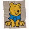 Winnie the Pooh C2C crochet blanket pattern featuring classic Pooh Bear in a blue shirt on a warm neutral background, handmade pixel graphghan blanket design.