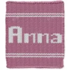 Anna Finger Knit Blanket Pattern - the name ANNA in white block lettering on a pink background with white stripes, worked in stockinette colorwork intarsia with 2 colors: Pink, White.