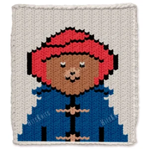 Paddington Bear Finger Knit Blanket Pattern - the storybook brown bear wearing a red hat and blue duffle coat on an ivory background, worked in stockinette colorwork intarsia with 6 colors: Ivory, Blue, Red, Black, Camel, Beige.