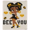 Bee You Chunky Blanket Knitting Pattern - a cute retro Betty Boop style girl in a fashion pose with golden bees and hearts and the words BEE YOU, worked in stockinette colorwork intarsia with 5 colors: Ivory, Black, Camel, Gold, Red.
