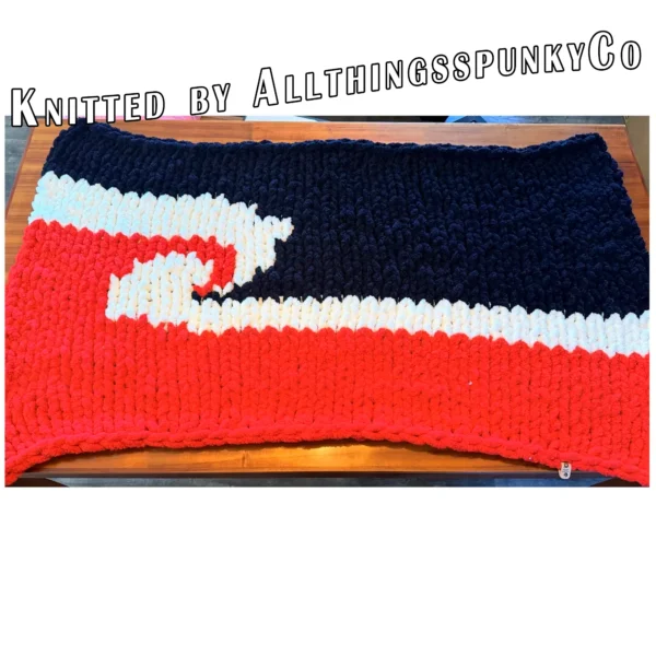 Maori Flag Blanket Finger Knitting Pattern - black, red and white Tino Rangatiratanga Maori sovereignty flag with a central white koru, bold high-contrast mood, worked in stockinette colorwork intarsia with 3 colors: Black, Red, and White.
