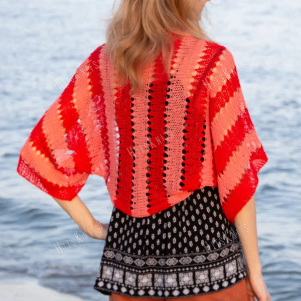 Easy striped lace bolero knitting pattern showing a loose summer shrug worked in thin cotton yarn with lace eyelet rows at each colour change, in coral and red stripes, one size fits most.