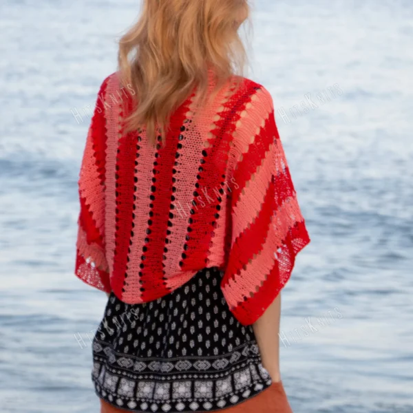Easy striped lace bolero knitting pattern showing a loose summer shrug worked in thin cotton yarn with lace eyelet rows at each colour change, in coral and red stripes, one size fits most.