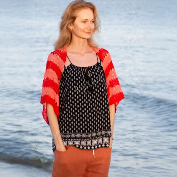 Easy striped lace bolero knitting pattern showing a loose summer shrug worked in thin cotton yarn with lace eyelet rows at each colour change, in coral and red stripes, one size fits most.