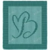 Calligraphic Letter B Panel Knitting Pattern showing a flowing cursive capital letter B in raised knit and purl texture on a square knitted panel with a garter stitch border, worked in one solid color, 100 stitches x 146 rows.