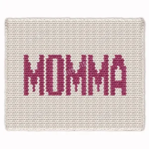 Momma Chunky Blanket Knitting Pattern showing the word MOMMA in soft mauve block letters running along the length of a warm ivory blanket, a mom and mama gift throw worked in stockinette colorwork intarsia with 2 colors: Ivory and Mauve.