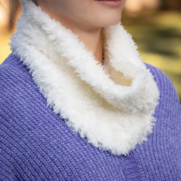 Free Easy Neck Warmer Knitting Pattern showing a soft cream white faux fur cowl worn close around the neck, knitted flat in garter stitch on 8 mm needles in one solid colour and seamed into a tube.