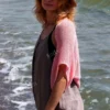 Lace Heart Bolero Knitting Pattern showing a lightweight pink lace shrug with an eyelet heart motif on the back, worked in sport weight cotton, sizes XS to 4XL.