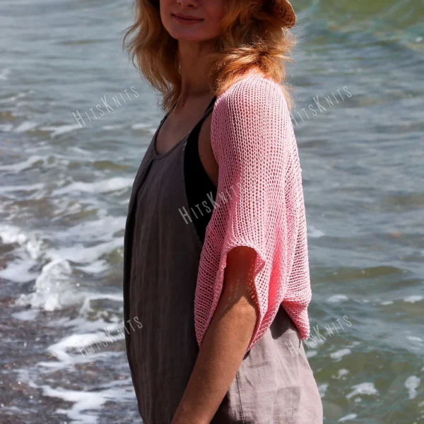 Lace Heart Bolero Knitting Pattern showing a lightweight pink lace shrug with an eyelet heart motif on the back, worked in sport weight cotton, sizes XS to 4XL.
