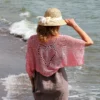 Lace Heart Bolero Knitting Pattern showing a lightweight pink lace shrug with an eyelet heart motif on the back, worked in sport weight cotton, sizes XS to 4XL.