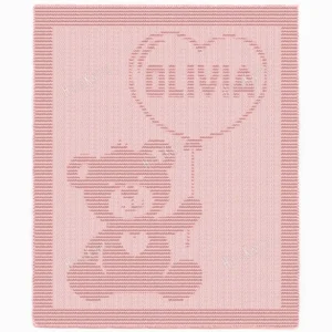 Olivia Stroller Blanket Knitting Pattern showing a textured teddy bear holding a heart-shaped balloon with the name Olivia inside, on a solid dusty rose blanket with a garter stitch border, worked in one color, 130 stitches x 230 rows.