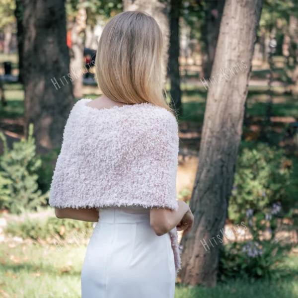 Free Faux Fur Wedding Poncho Knitting Pattern showing a soft white fluffy triangular poncho draped over the shoulders with a long front point, worked in garter stitch, one size fitting S, M, and L.