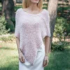 Free Faux Fur Wedding Poncho Knitting Pattern showing a soft white fluffy triangular poncho draped over the shoulders with a long front point, worked in garter stitch, one size fitting S, M, and L.