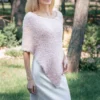 Free Faux Fur Wedding Poncho Knitting Pattern showing a soft white fluffy triangular poncho draped over the shoulders with a long front point, worked in garter stitch, one size fitting S, M, and L.