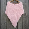 Free Faux Fur Wedding Poncho Knitting Pattern showing a soft white fluffy triangular poncho draped over the shoulders with a long front point, worked in garter stitch, one size fitting S, M, and L.