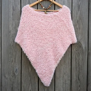 Free Faux Fur Wedding Poncho Knitting Pattern showing a soft white fluffy triangular poncho draped over the shoulders with a long front point, worked in garter stitch, one size fitting S, M, and L.