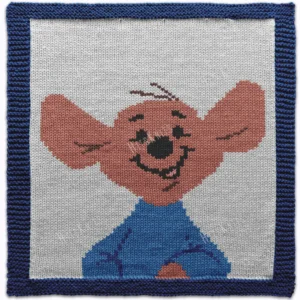 Roo Intarsia Knit Panel Pattern showing the little kangaroo joey from Winnie the Pooh with soft almond fur, rounded eyes, and a small black nose on a white ground with a blue garter stitch border, worked in stockinette intarsia colorwork with 7 colors: Blue, White, Sky, Almond, Brown, Black, and Pink.