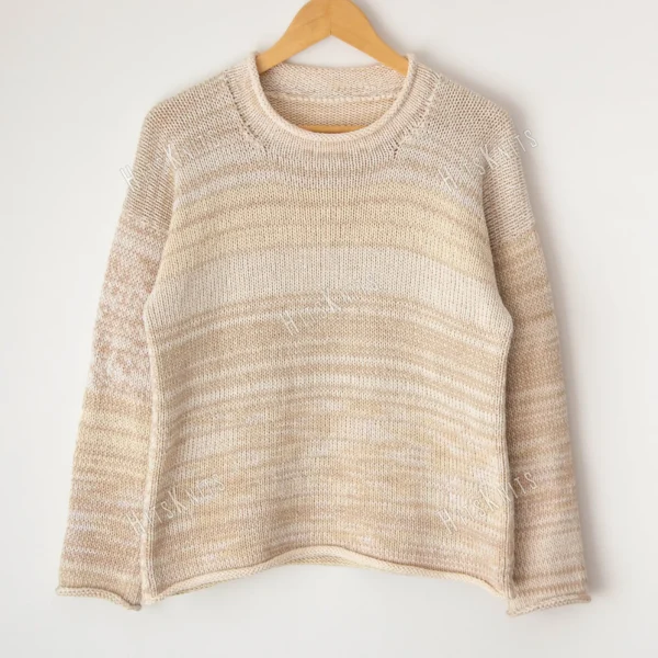 Cozy Women's Basic Sweater Knitting Pattern showing a relaxed drop-shoulder pullover in marled cream, oat, and sand, worked in stockinette stitch with rolled hem, cuffs, and neckline, sizes S to 2XL.