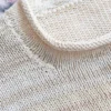 Cozy Women's Basic Sweater Knitting Pattern showing a relaxed drop-shoulder pullover in marled cream, oat, and sand, worked in stockinette stitch with rolled hem, cuffs, and neckline, sizes S to 2XL.