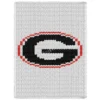 Georgia Bulldogs Chunky Blanket Knit Pattern showing a bold black block letter G inside a red oval outline on a white background, worked in stockinette colorwork with 3 colors: White, Red, and Black.