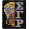 Sigma Gamma Rho Finger Knit Blanket Pattern, a half-face portrait of a Black woman in a gold-and-blue head wrap with a bold earring, greek letters Sigma Gamma Rho beside her, worked in stockinette colorwork intarsia with 5 colors: Black, Gold, Blue, Camel, and Ivory.