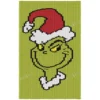 Grinch Knit Blanket Pattern, the Grinch face in a Santa hat on lime green, festive Christmas throw, worked in stockinette colorwork with 5 colors: Lime, Black, White, Red, Yellow.