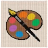 Artist Palette Knit Pillow Panel Pattern - a brown artist's paint palette with six colorful paint blobs and a paintbrush on a cream background, worked in stockinette colorwork intarsia with 10 colors.